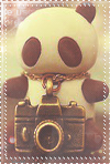 Игрушка панда с  фотоаппаратом