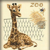Жираф лежит в зоопарке